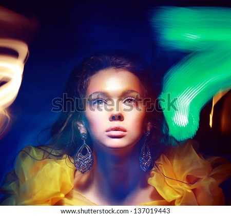Blurs. Portrait of Woman in Multicolor Blurry Shadows