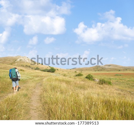 Man walking along the road
