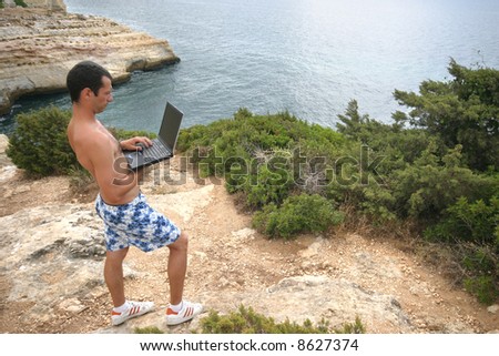man working in pc on the coast