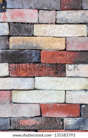 Random painted brick wall. Vertical composition