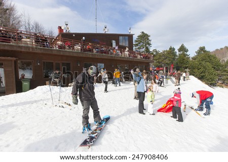 ELATOCHORI, GREECE - DECEMBER 24, 2009: Tourists at the Elatochori Ski Center, in the northeast side of Pieria Mountains, Greece