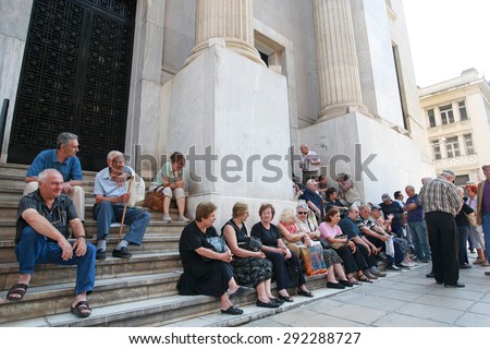 GREECE, Thessaloniki JUNE 29, 2015: Greek debt crisis. Elderly people wait outside a closed national bank in Thessaloniki hoping to take their pensions.