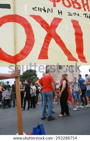 GREECE, Thessaloniki JUNE 29, 2015: Greek crisis. Pro-government supporters of the NO vote in the upcoming referendum protest holding banners reading NO (OXI in greek) during a rally in Thessaloniki