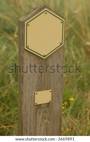 empty wooden sign in grass