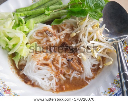 Closeup of Thai local style noodle, pour with sweet chili-bean sauce