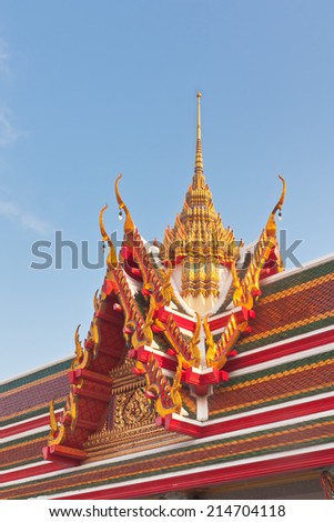 Thai Buddhist temple roof gable with tiered and carved apex