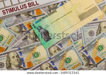 Economic government relief Word COVID-19 on global pandemic lockdown on financial lockdown from government US 100 dollar bills currency Photo stock © 
