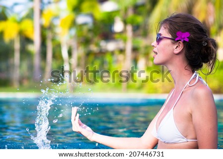 half face view of fit woman in luxury spa pool