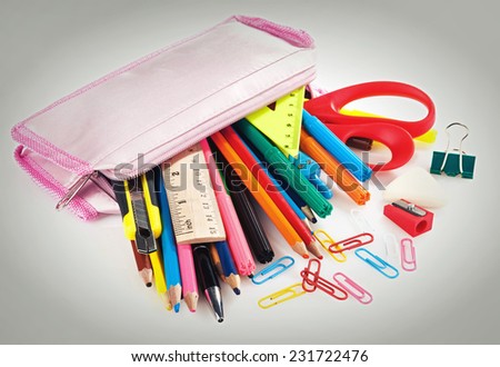 pencil box full of school supplies