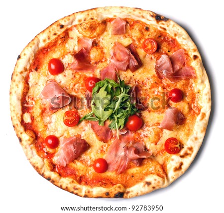 appetizing round pizza with ham, tomatoes and greens