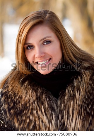 portrait of woman in winter clothes on the street