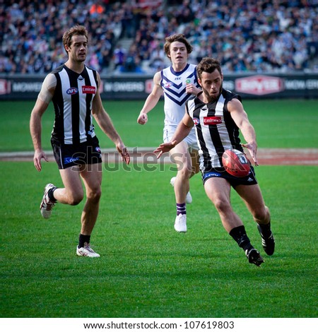 MELBOURNE - JUNE 30 : Jarryd Blair (R) kicks during Collingwood\'s win over Fremantle on June 30, 2012 in Melbourne, Australia.