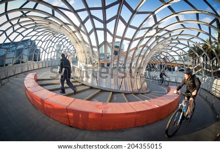 MELBOURNE, AUSTRALIA - July 3 2014:  Webb Bridge is an award winning bridge crossing the Yarra River at Docklands Park