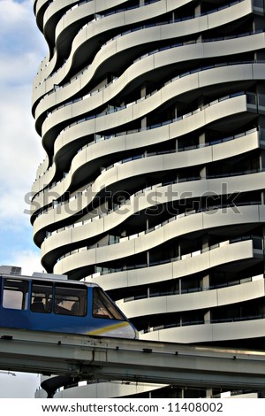 Monorail passing cool apartment building