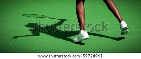 Tennis player and shadow