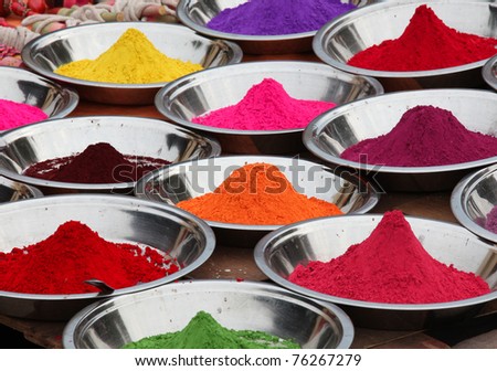 Colored powders at market in Orchha, India