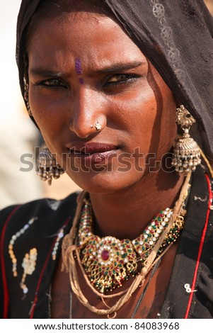 PUSHKAR, INDIA - NOVEMBER 19: An unidentified girl attends the Pushkar fair on November 19, 2010 in Pushkar, Rajasthan, India. Pilgrims and camel traders flock to the holy town for the annual fair.