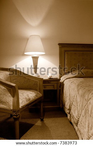 old sepia looking interior of a hotel room