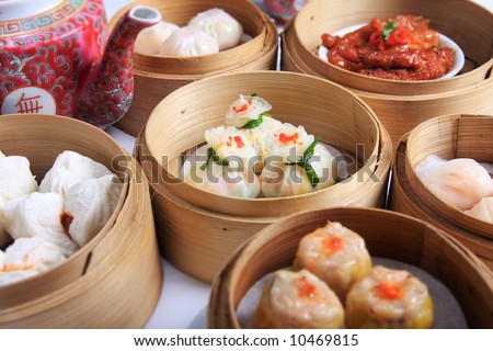 A variety of dim sum in bamboo steam containers