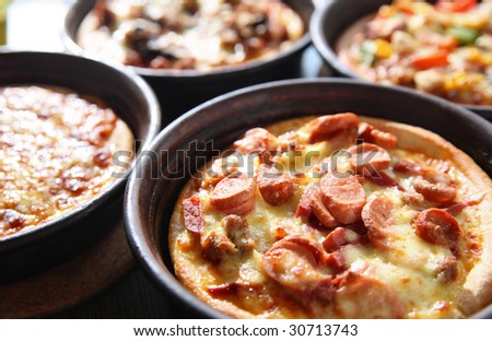 a variety of pizza in pan