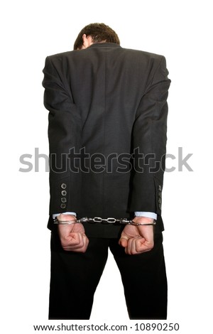 man in black suit and handcuffs from behind isolated on white