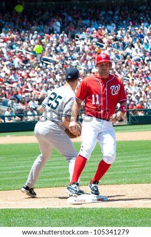 WASHINGTON - JUNE 16:  Ryan Zimmerman touches first base during the Washington Nationals - New York Yankees game, which the Yankees won after 14 innings of play, on June 16, 2012 in Washington, D.C.