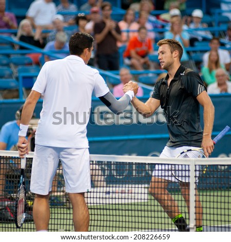 WASHINGTON - JULY 30: Milos Raonic (CAN) and Jack Sock (USA) shake hands after their match at the Citi Open tennis tournament on July 30, 2014 in Washington DC. Raonic won.