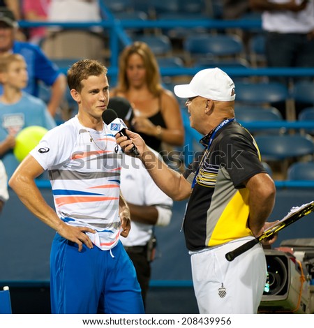WASHINGTON - JULY 31: Vasek Pospisil (CAN) is interviewed after his upset over top seed Tomas Berdych (CZE, not pictured) at the Citi Open tennis tournament on July 31, 2014 in Washington DC