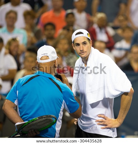 WASHINGTON - AUGUST 8: John Isner (USA) is interviewed after beating Steve Johnson (USA, not pictured) in the semifinal round of the Citi Open tennis tournament on August 8, 2015 in Washington DC
