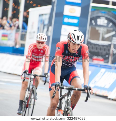RICHMOND, VIRGINIA - SEPTEMBER 26: Cyclists cross the finish line of the junior men\'s road race at the UCI Road World Championships on September 26, 2015 in Richmond, Virginia