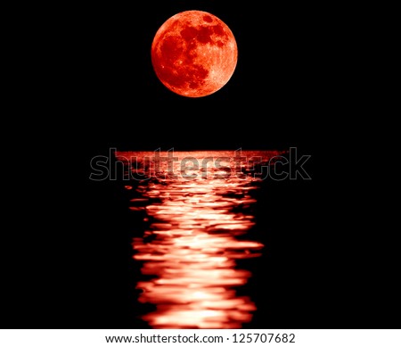 Full red moon with reflection closeup showing the details of the lunar surface.As seen from Varna,Bulgaria