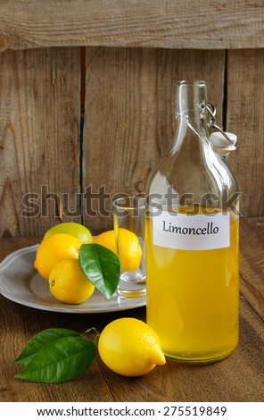Limoncello  - Italian alcoholic beverage, on wooden table