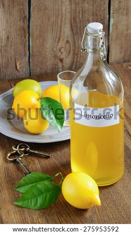 Italian alcoholic beverage, Limoncello on wooden table