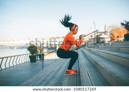 Fitness woman jumping outdoor in urban environment Stock fotó © 