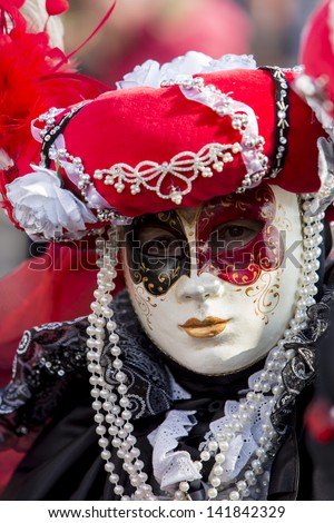 VENICE, ITALY - FEBRUARY 10: Unidentified person with traditional Venetian carnival mask in Venice, Italy on February 10, 2013. At 2013 it is held from January 26th to February 12th.