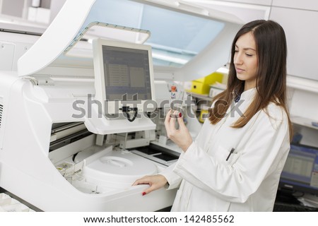 Young woman in the modern medical laboratory
