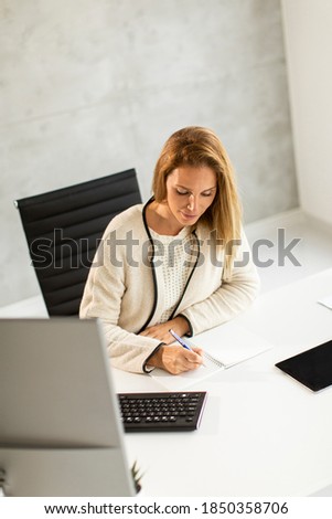 Similar – Image, Stock Photo Bbeautiful businesswoman working on laptop in bright modern office