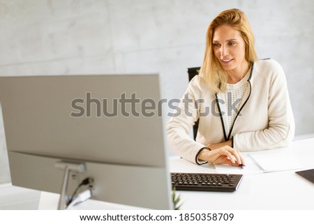 Similar – Image, Stock Photo Bbeautiful businesswoman working on laptop in bright modern office