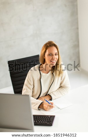 Similar – Image, Stock Photo Bbeautiful businesswoman working on laptop in bright modern office