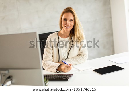 Similar – Image, Stock Photo Bbeautiful businesswoman working on laptop in bright modern office