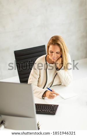 Similar – Image, Stock Photo Bbeautiful businesswoman working on laptop in bright modern office