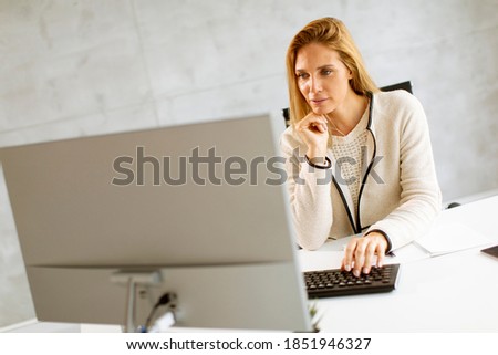 Similar – Image, Stock Photo Bbeautiful businesswoman working on laptop in bright modern office