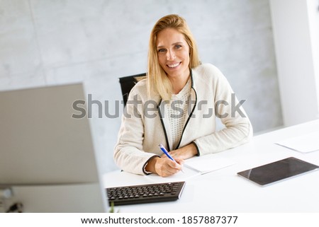 Image, Stock Photo Bbeautiful businesswoman working on laptop in bright modern office