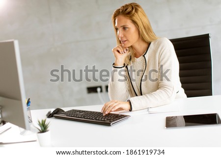 Similar – Image, Stock Photo Bbeautiful businesswoman working on laptop in bright modern office