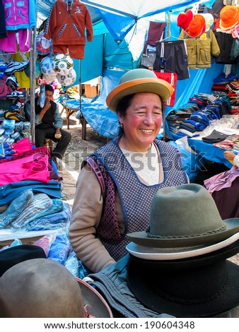 PISAC, PERU - MARCH 2, 2006: Unidentified woman on the market Pisac. It is a Peruvian village in the Sacred Valley. The village is well known for its market every Sunday, Tuesday, and Thursday.