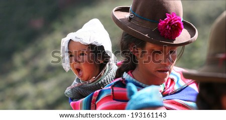 PISAC, PERU - MARCH 5, 2006: Unidentified people at Inca citadel in Sacred Valley near Pisac in Peru. Sacred Valley of the Incas in the Southern Sierra contains many famous and beautiful Inca ruins