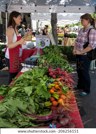 DENVER, USA - JUNE 29, 2014: Unidentified people at South Pearl Street Farmers Market in Denver. Market was founded at 2001 and today have more than 60 vendors.