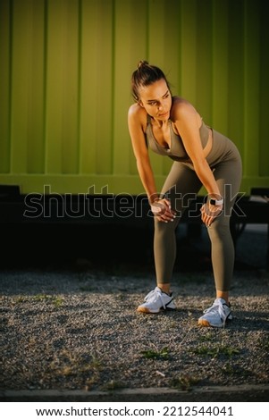 Similar – Image, Stock Photo Attractive female runner taking break after jogging outdoors