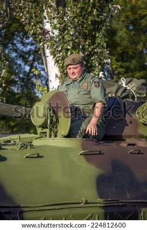 BELGRADE, SERBIA, OCTOBER 10, 2014: Unidentified soldier in Infantry Fighting Vehicle of Serbian Armed Forces. They are preparing for parade marking 70th anniversary of Belgrade liberation in WWII.