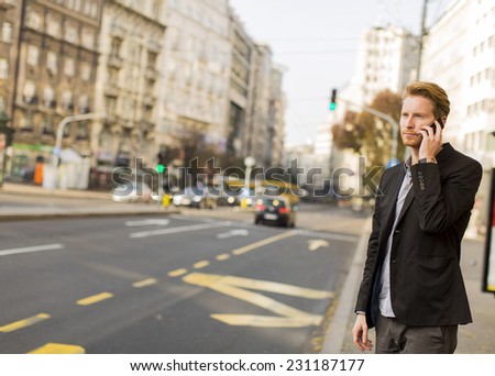 Young man on the street with mobile phone
